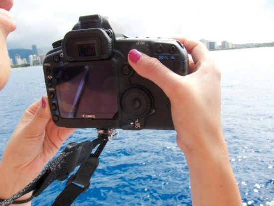 Photographer using Custom SLR C-Loop on camera