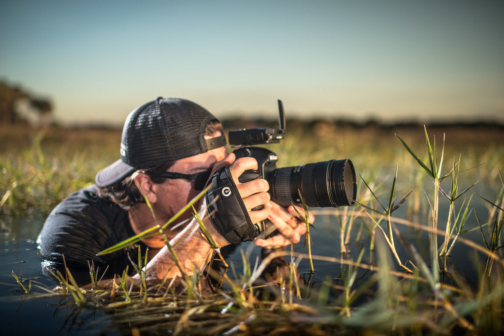 Photographer using Camera Hand Strap outdoors